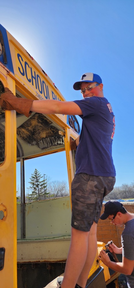Small Engines 1 class getting their hands on the bus, using new tools and experience body work on vehicles 