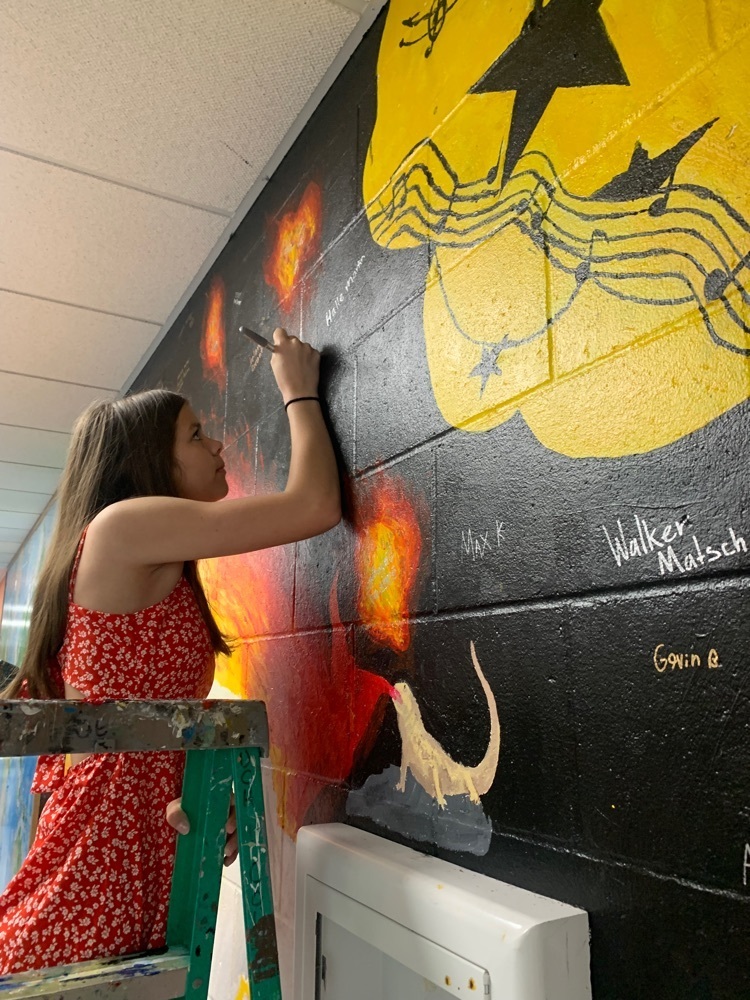Signing the mural