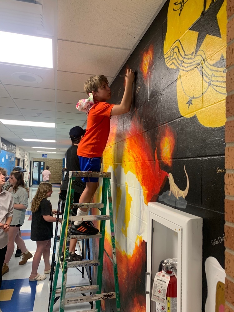 Signing the mural